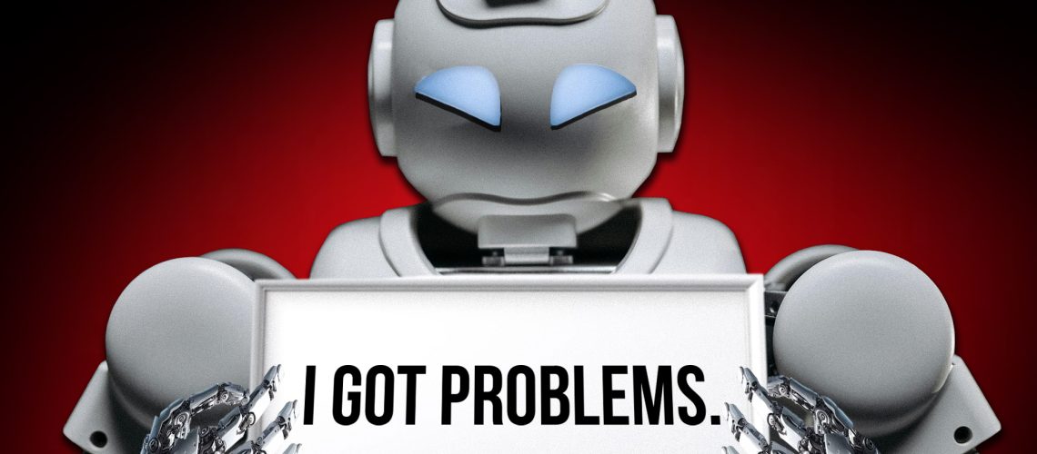 A picture of a robot holding a sign that says "I got problems"